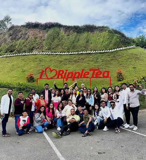 Malang tour group visiting the tea gardens in Kerala
