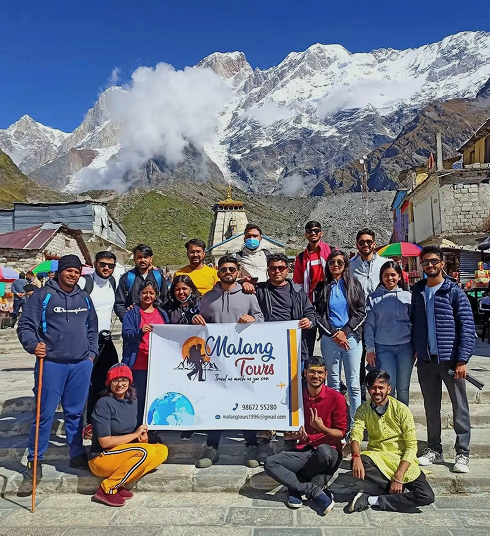 Malang travellers at Kedarnath with the Himalayas behind them